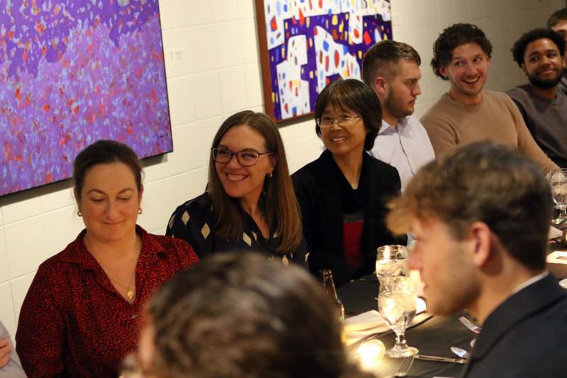 a group of people sitting around a table