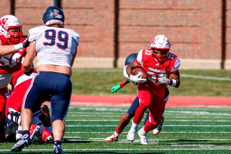 a football player running with the ball