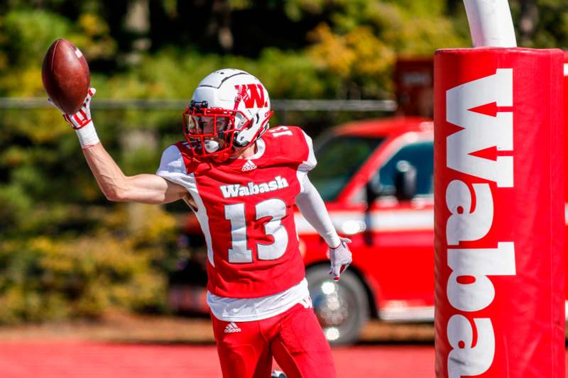 a football player in a red uniform