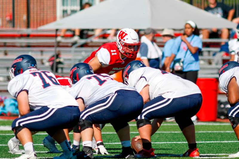 a group of people playing football