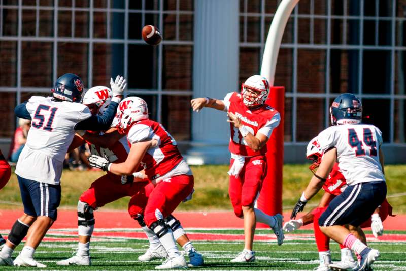 a group of people playing football