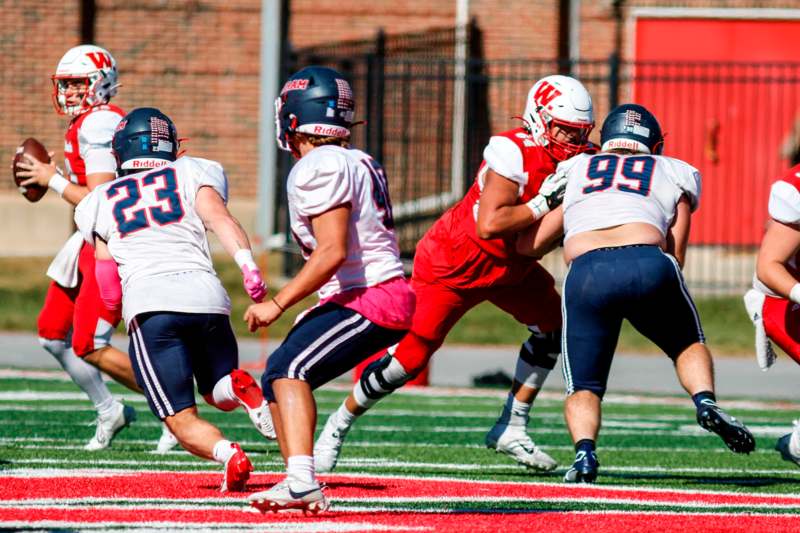 a group of people playing football