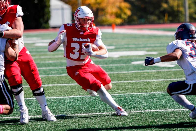 a football player running with a ball