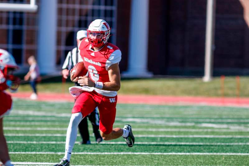 a football player running with a football