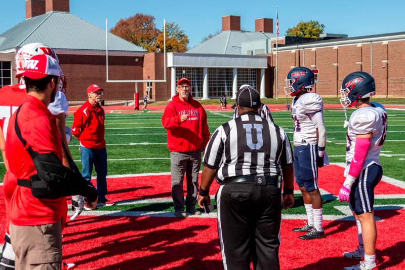 a group of people on a football field