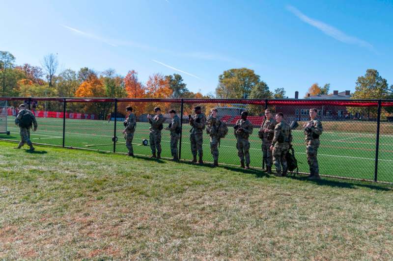 a group of people in uniform standing in a line