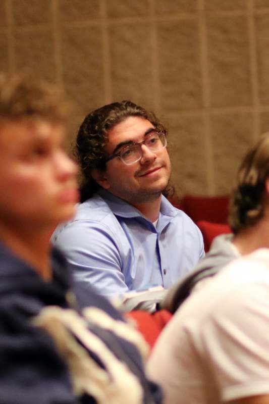 a man in glasses looking up