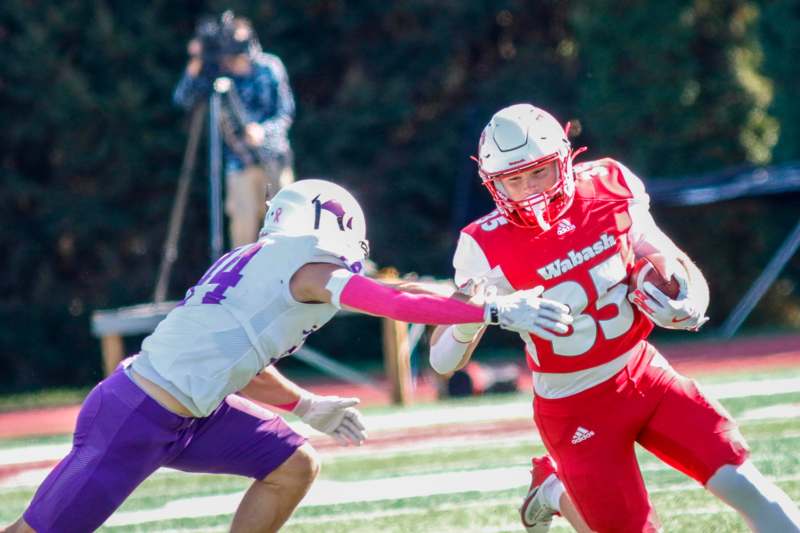 a football players running with the ball