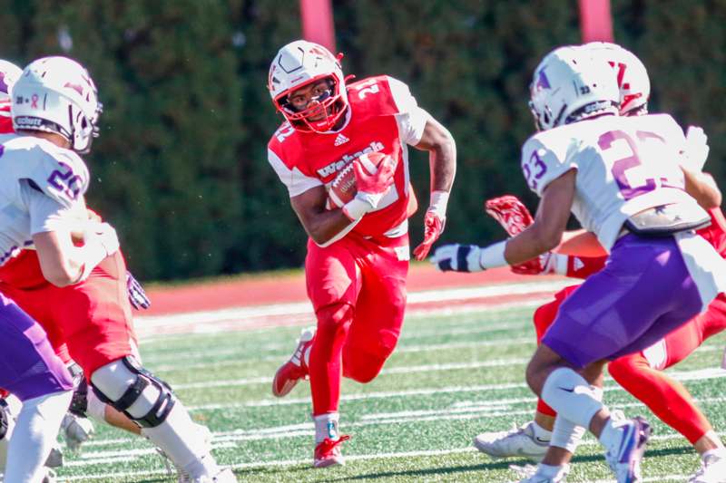 a football player running with the ball