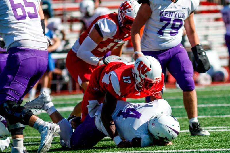 a football player falling on the ground