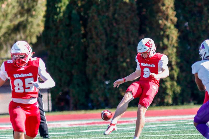 a football player kicking a football