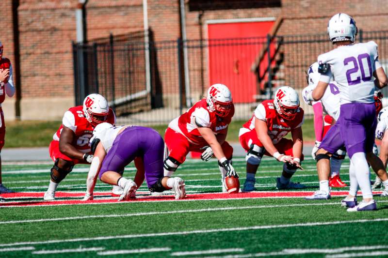 a group of football players on a field