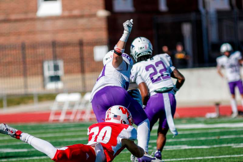 a football player falling down to the ground