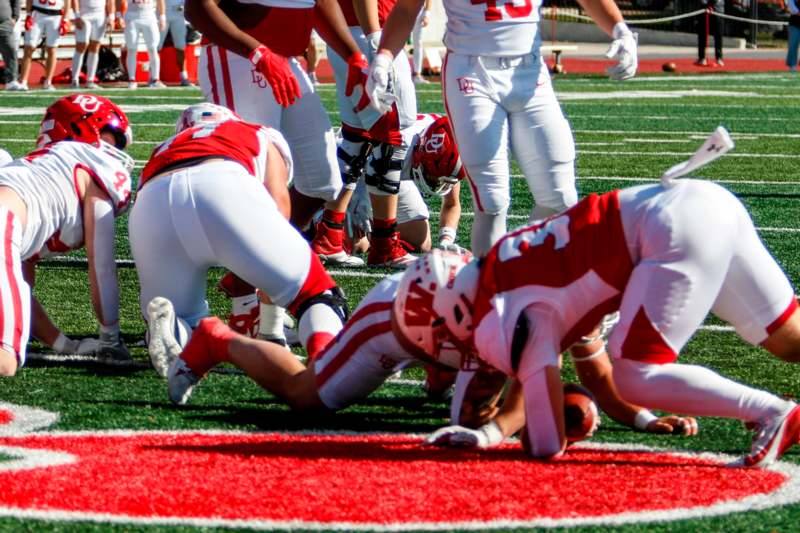 a football player falling on the ground