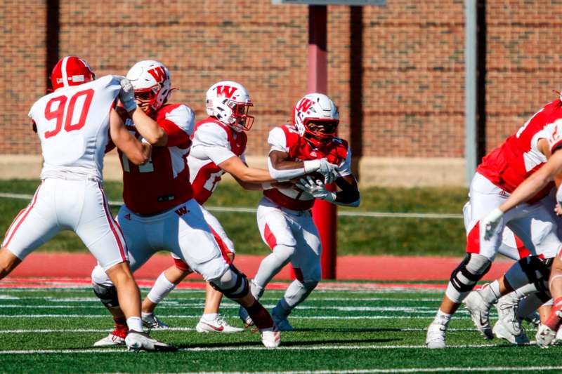 a group of football players on a field