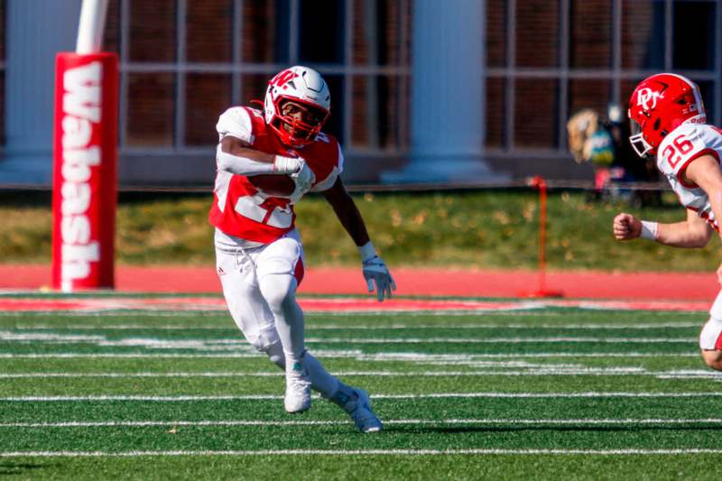 a football player running on a field