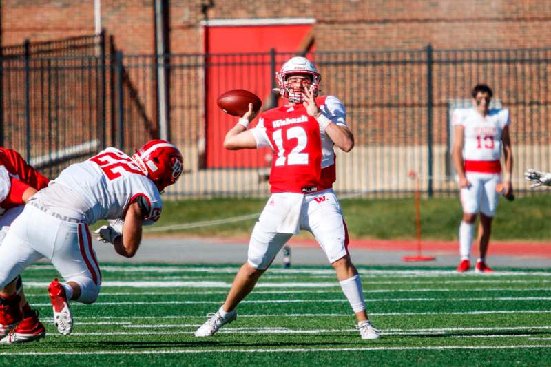 a football player throwing a football