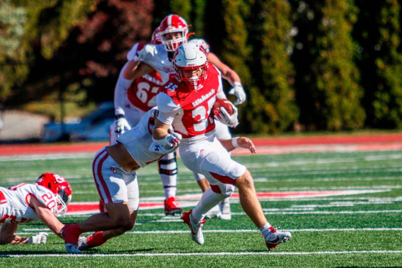 a football player running with the ball