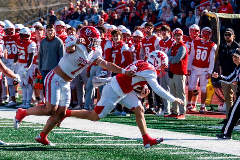 a football players running with the ball