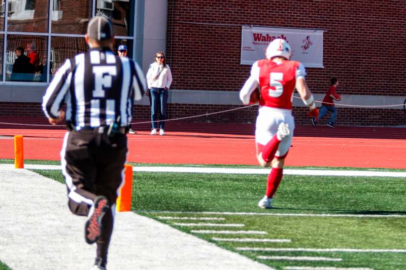 a football player running on a field