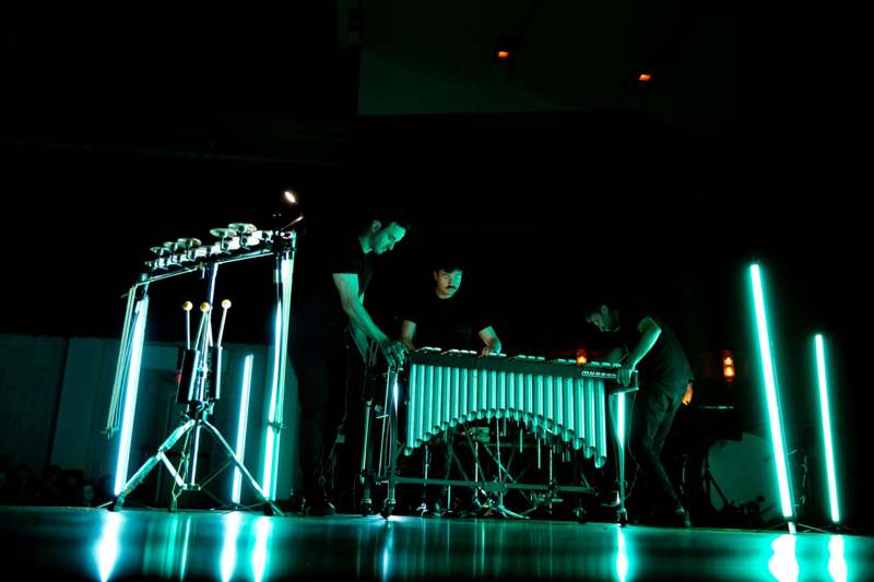 a group of men playing a musical instrument