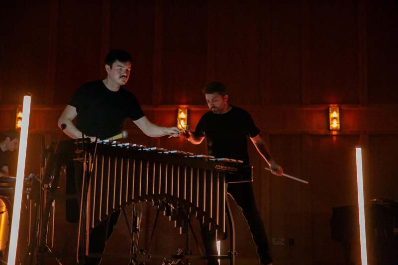 two men playing a musical instrument