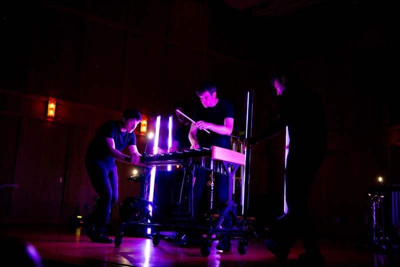 a group of men playing a keyboard