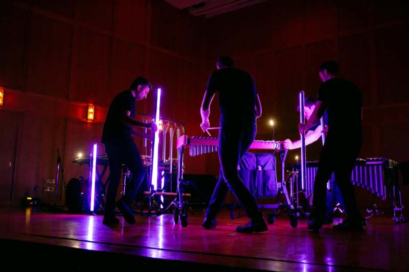 a group of people playing instruments