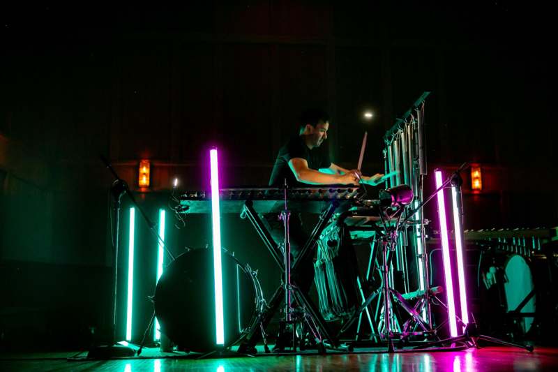 a man playing a drum set