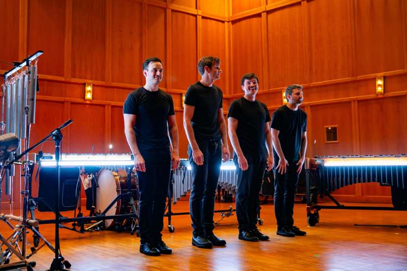 a group of men in black shirts