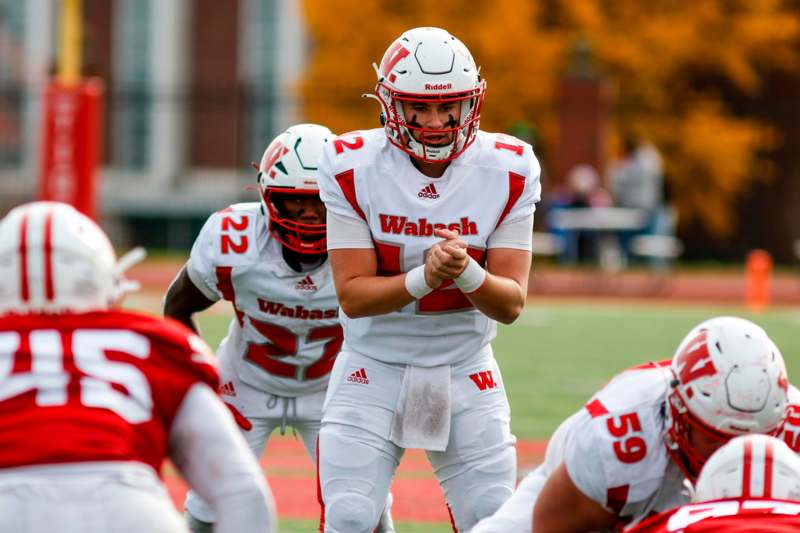 a football player in a white uniform