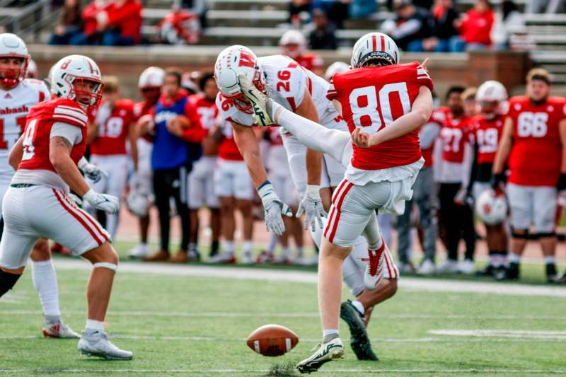 a football player kicking the ball