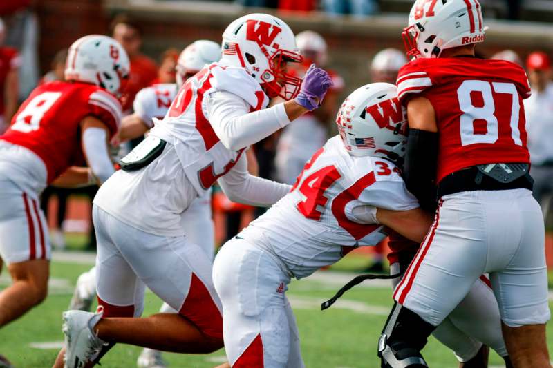 a group of football players in a huddle