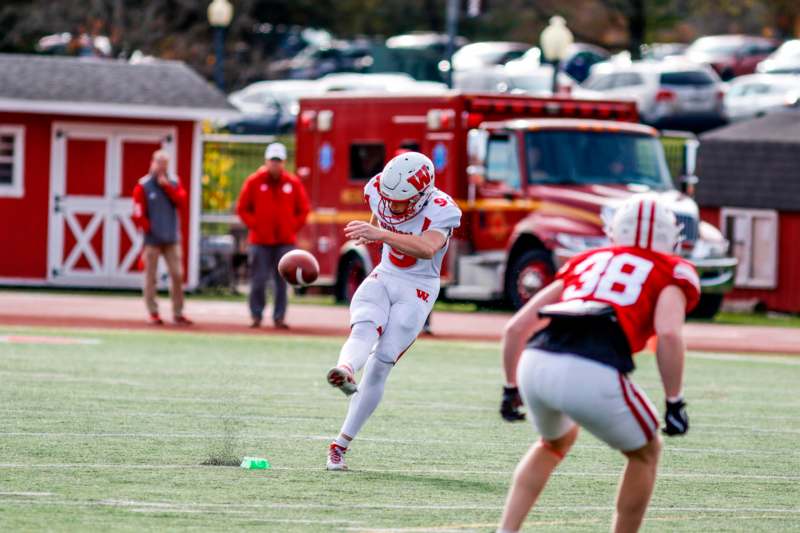 a football player running with a football