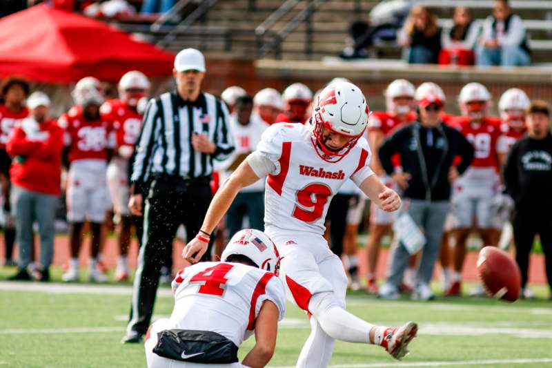 a football player falling off the ground