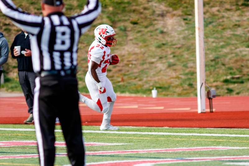 a football player running on a field