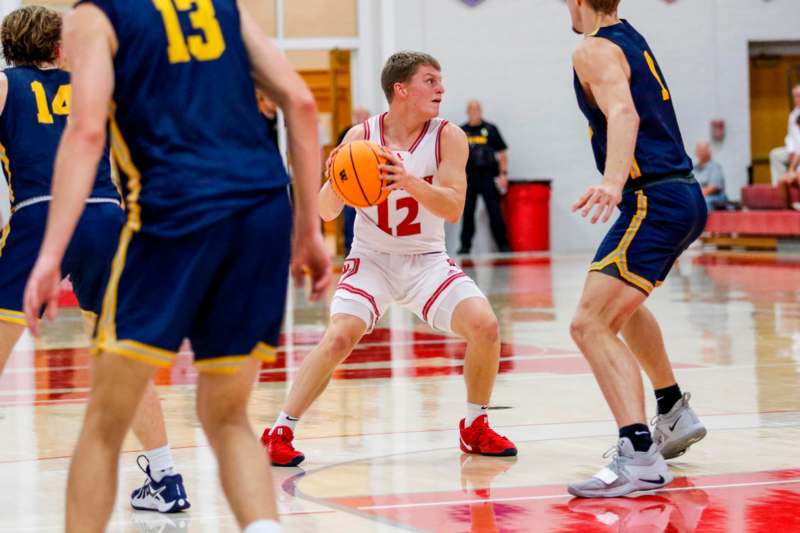 a group of men playing basketball