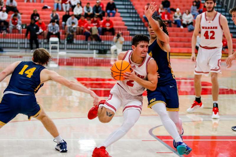 a group of men playing basketball