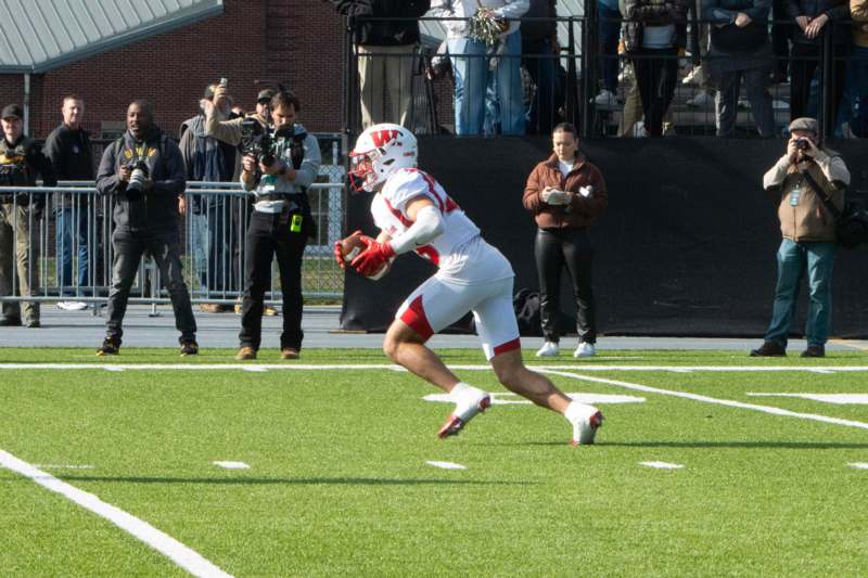 a football player running on a field