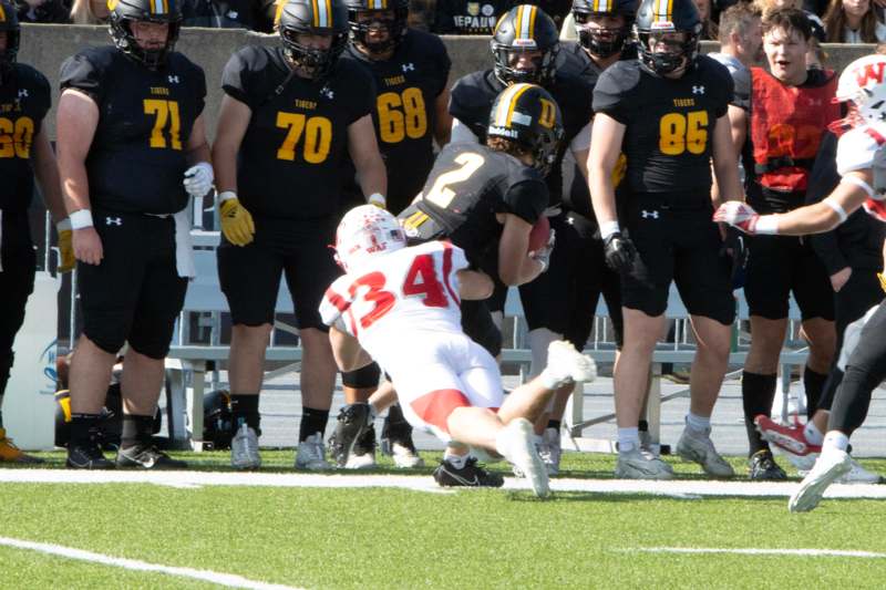 a football player diving for a ball