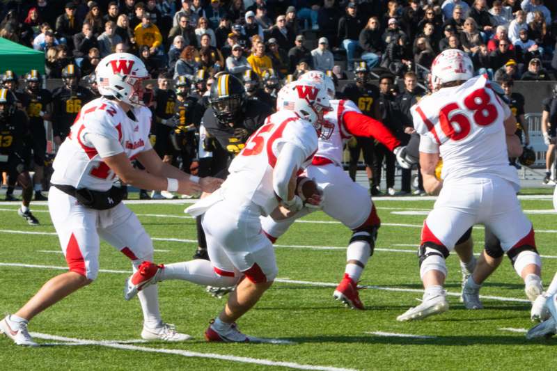 a group of football players on a field