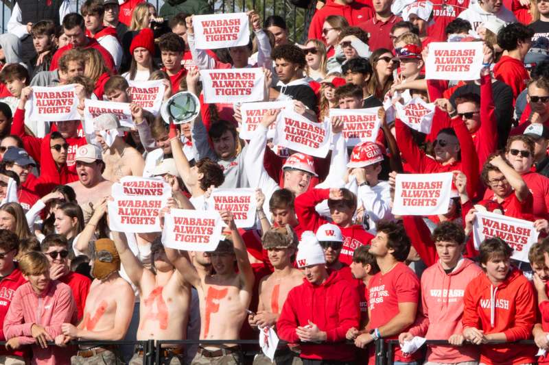 a large crowd of people holding signs