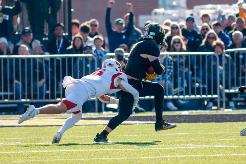 a football player running with the ball