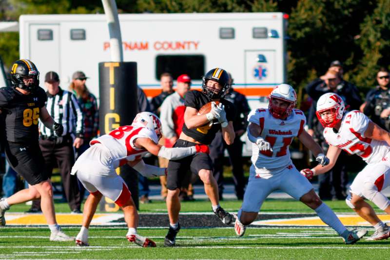 a football player running with the ball