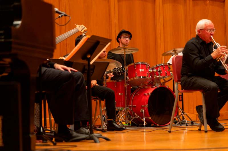 a group of people playing instruments