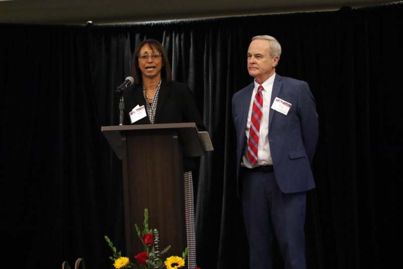 a man and woman standing at a podium