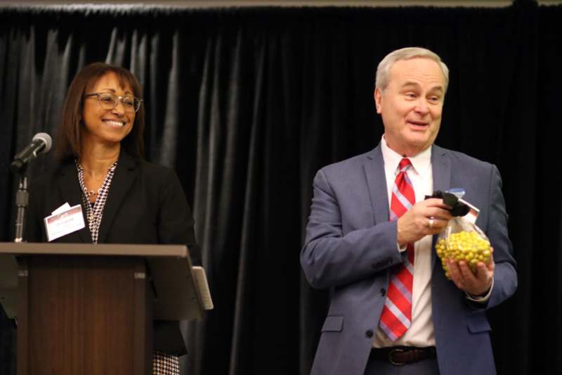 a man and woman standing at a podium