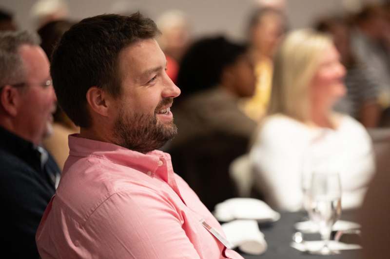 a man in a pink shirt