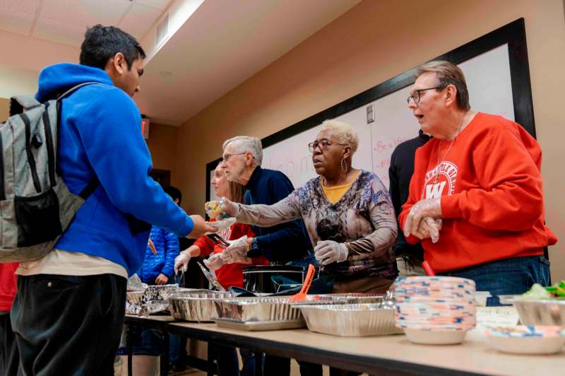 a group of people serving food