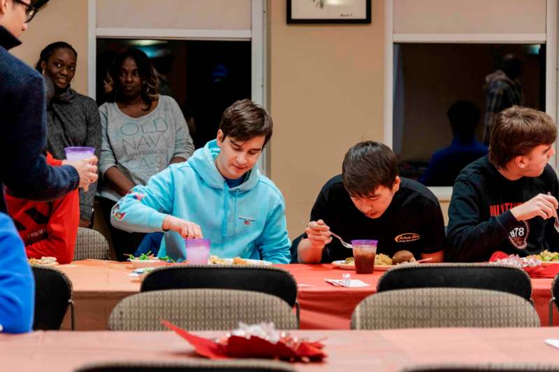 a group of people around a table